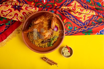 Plate of kabsa rice with chicken from the top, traditional Saudi food, Saudi restaurant, Saudi dishes