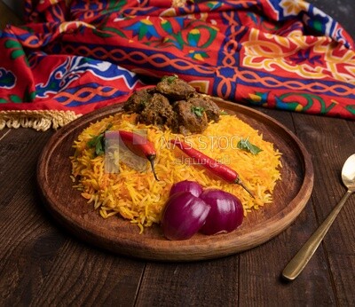 Wooden plate of delicious biryani rice with meat,  traditional Arabic dishes, Arabic food, popular dishes, delicious recipes and dishes, delicious food