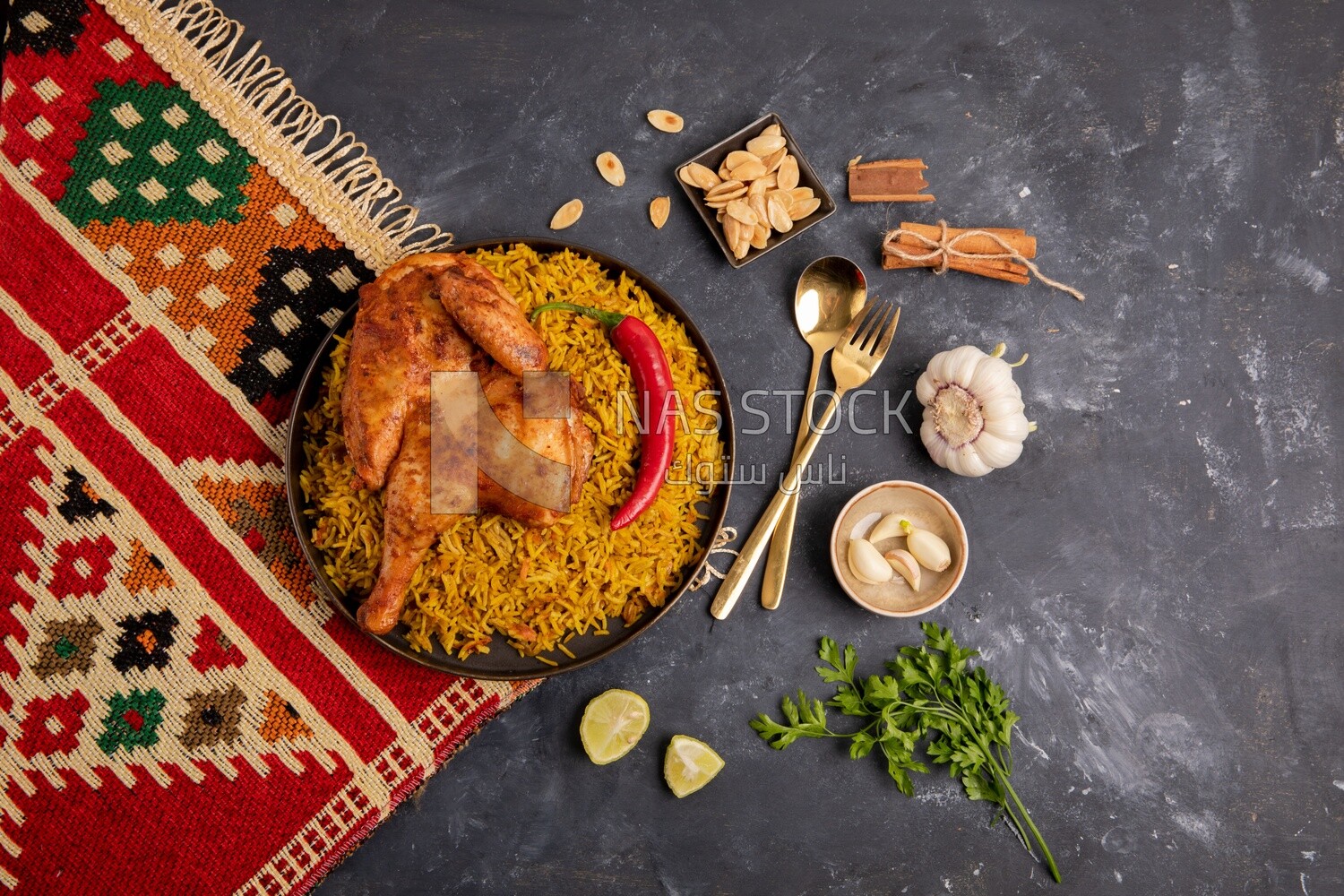 Plate of kabsa rice with chicken from the top, traditional Saudi food, Saudi restaurant, Saudi dishes