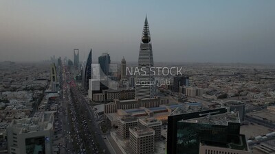 drone footage of  Al-Faisaliah Tower in Riyadh, the towers on King Fahd Road, famous towers in Riyadh, Riyadh roads and streets, car traffic in Riyadh