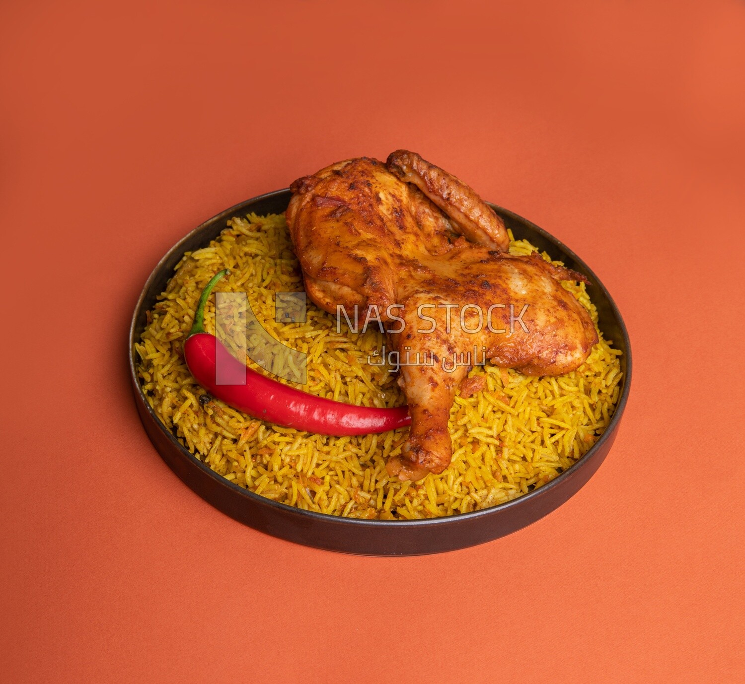 Plate of kabsa rice with chicken, traditional Saudi food, Saudi restaurant, Saudi dishes