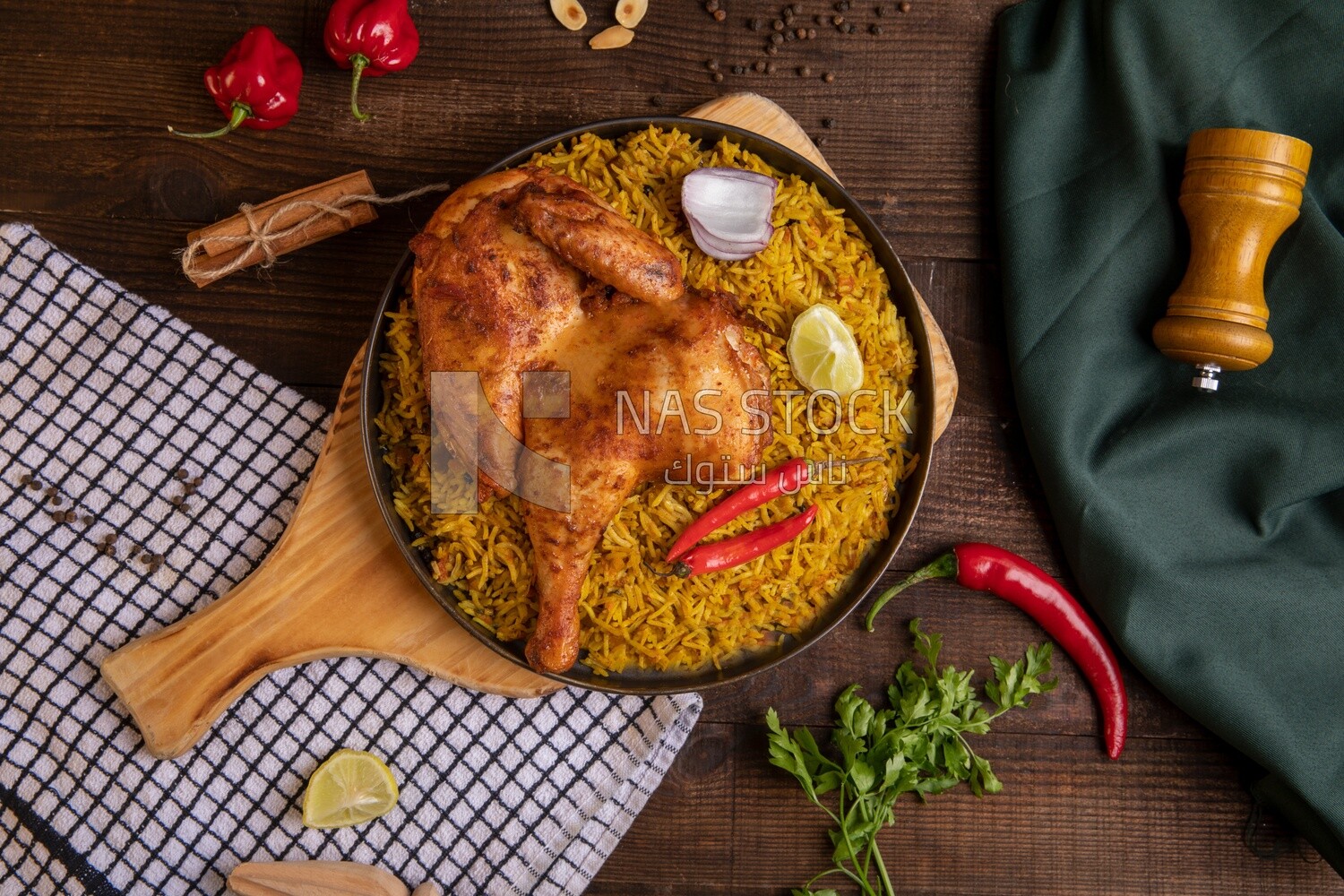 Plate of kabsa rice with chicken from the top, traditional Saudi food, Saudi restaurant, Saudi dishes