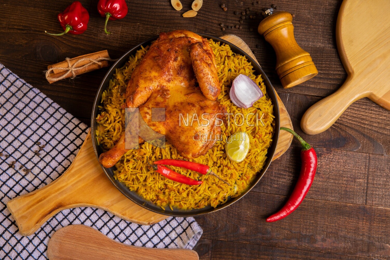 Plate of kabsa rice with chicken from the top, traditional Saudi food, Saudi restaurant, Saudi dishes