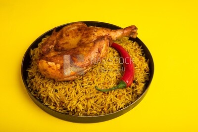 Plate of kabsa rice with chicken, traditional Saudi food, Saudi restaurant, Saudi dishes