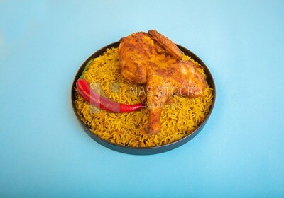 Plate of kabsa rice with chicken, traditional Saudi food, Saudi restaurant, Saudi dishes