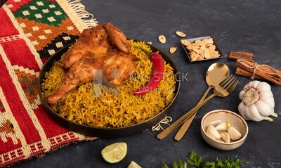 Plate of kabsa rice with chicken, traditional Saudi food, Saudi restaurant, Saudi dishes