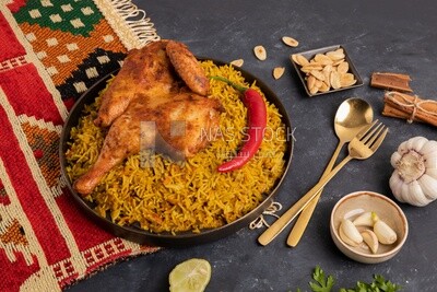 Plate of kabsa rice with chicken, traditional Saudi food, Saudi restaurant, Saudi dishes