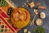 Plate of kabsa rice with chicken from the top, traditional Saudi food, Saudi restaurant, Saudi dishes