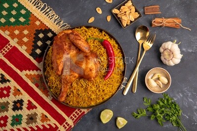Plate of kabsa rice with chicken from the top, traditional Saudi food, Saudi restaurant, Saudi dishes