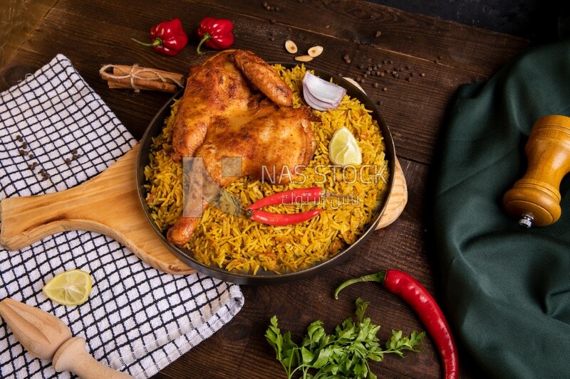 Plate of kabsa rice with chicken, traditional Saudi food, Saudi restaurant, Saudi dishes