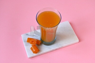 Cup of Qamar Al Deen juice with dried apricots, Ramadan juice, delicious juice, traditional juice