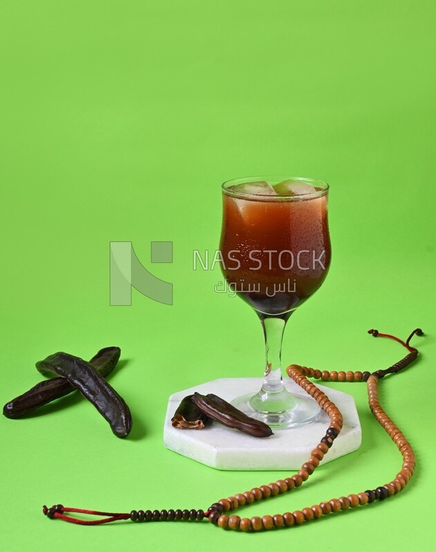 Carob cup with carob sticks , cold drinks, delicious natural juices, healthy and useful juice