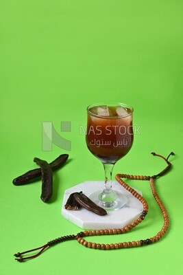 Carob cup with carob sticks , cold drinks, delicious natural juices, healthy and useful juice