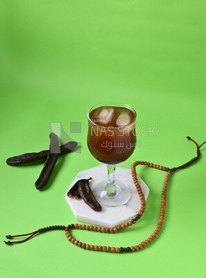 Carob cup with carob sticks , cold drinks, delicious natural juices, healthy and useful juice