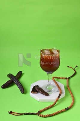 Carob cup with carob sticks , cold drinks, delicious natural juices, healthy and useful juice