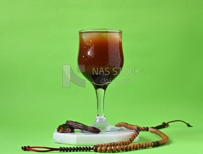 Carob cup with carob sticks , cold drinks, delicious natural juices, healthy and useful juice