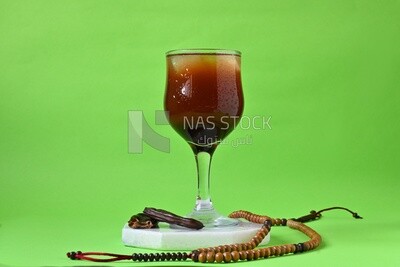 Carob cup with carob sticks , cold drinks, delicious natural juices, healthy and useful juice