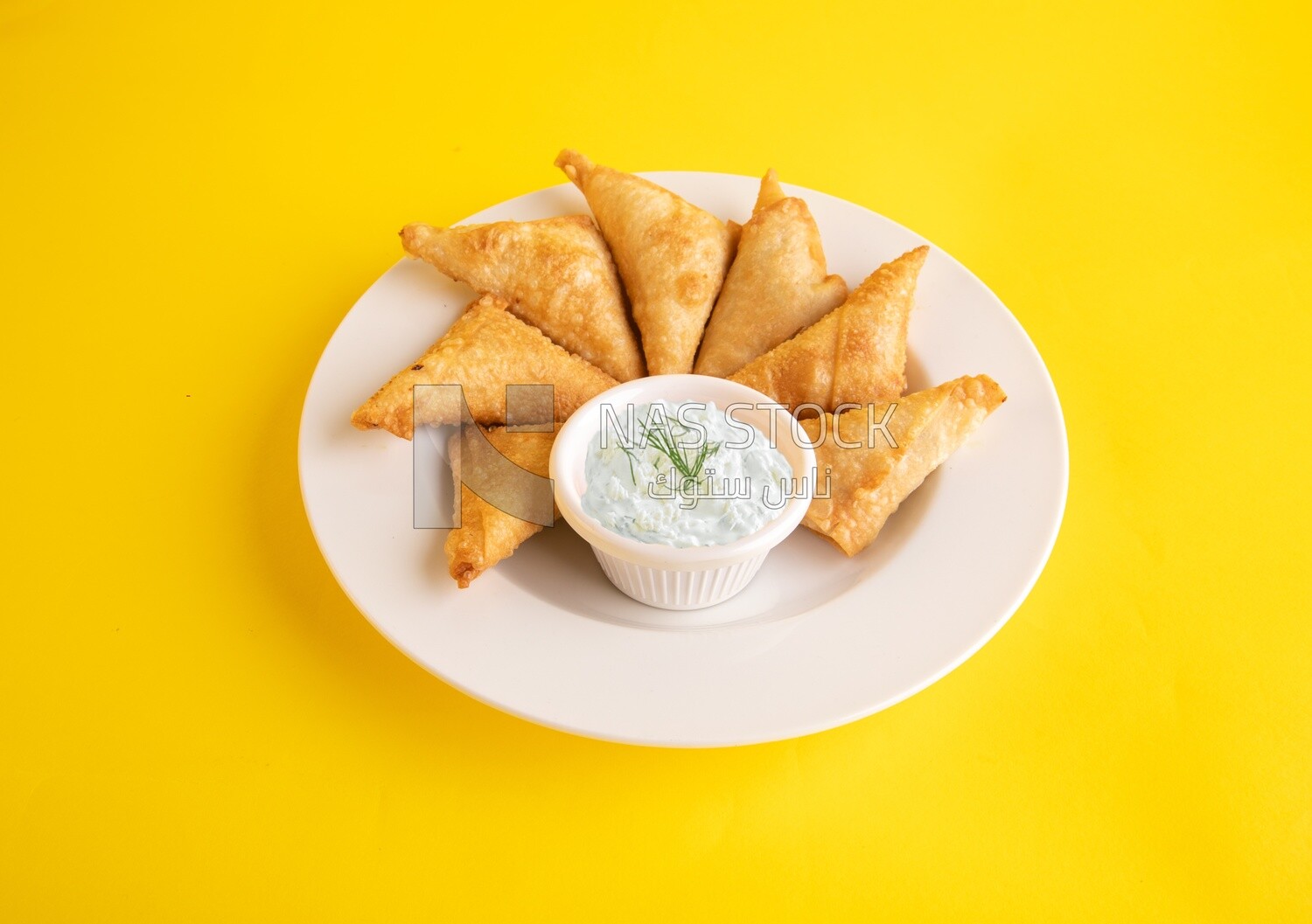 Plate of samosa with yogurt salad, popular dishes, appetizers, Arabic dishes, oriental dishes, restaurants for oriental Arabic food, delicious meals
