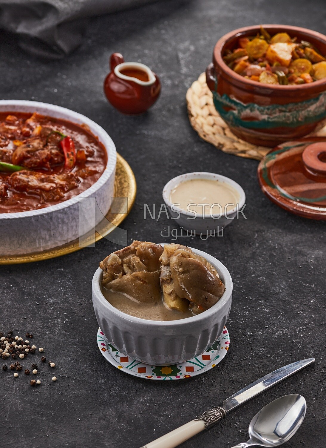 Bowl of trotters soup with vegetable torly, casserole of delicious trotter soup, Arabic meals, trotter soup