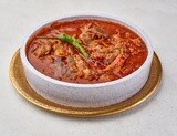 Bowl of trotters soup with red sauce, casserole of delicious trotter soup, Arabic meals, trotter soup