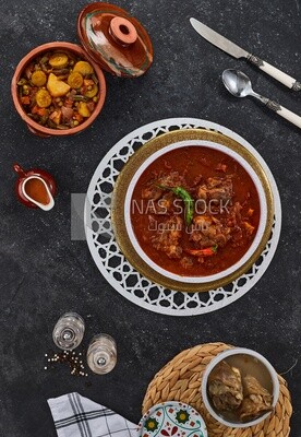 Bowl of trotters soup with vegetable torly, casserole of delicious trotter soup, Arabic meals, trotter soup