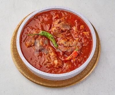 Bowl of trotters soup with red sauce, casserole of delicious trotter soup, Arabic meals, trotter soup