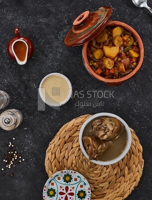 Bowl of trotters soup with vegetable torly, casserole of delicious trotter soup, Arabic meals, trotter soup