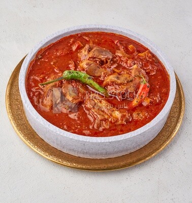 Bowl of trotters soup with red sauce, casserole of delicious trotter soup, Arabic meals, trotter soup