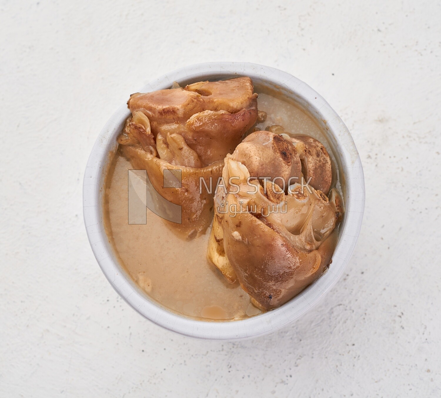 Bowl of trotters soup, casserole of delicious trotter soup, Arabic meals, trotter soup