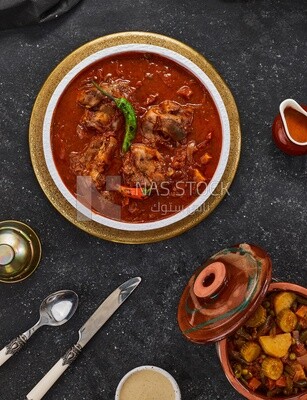 Bowl of trotters soup with red sauce, casserole of delicious trotter soup, Arabic meals, trotter soup