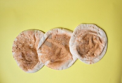 Shami bread, pieces of shami bread, fresh baked shami bread