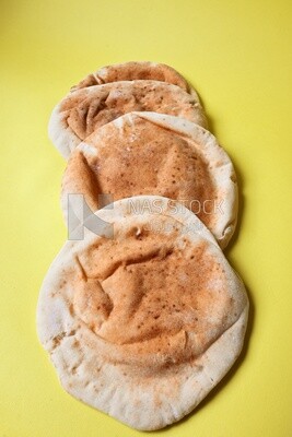 Shami bread, pieces of shami bread, fresh baked shami bread