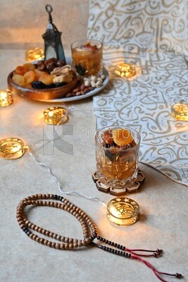 Two cups of khoshaf and a bowl full of khoshaf, Dried Fruit, and nuts salad, delicious dessert, Ramadan juice, delicious juice, traditional juice