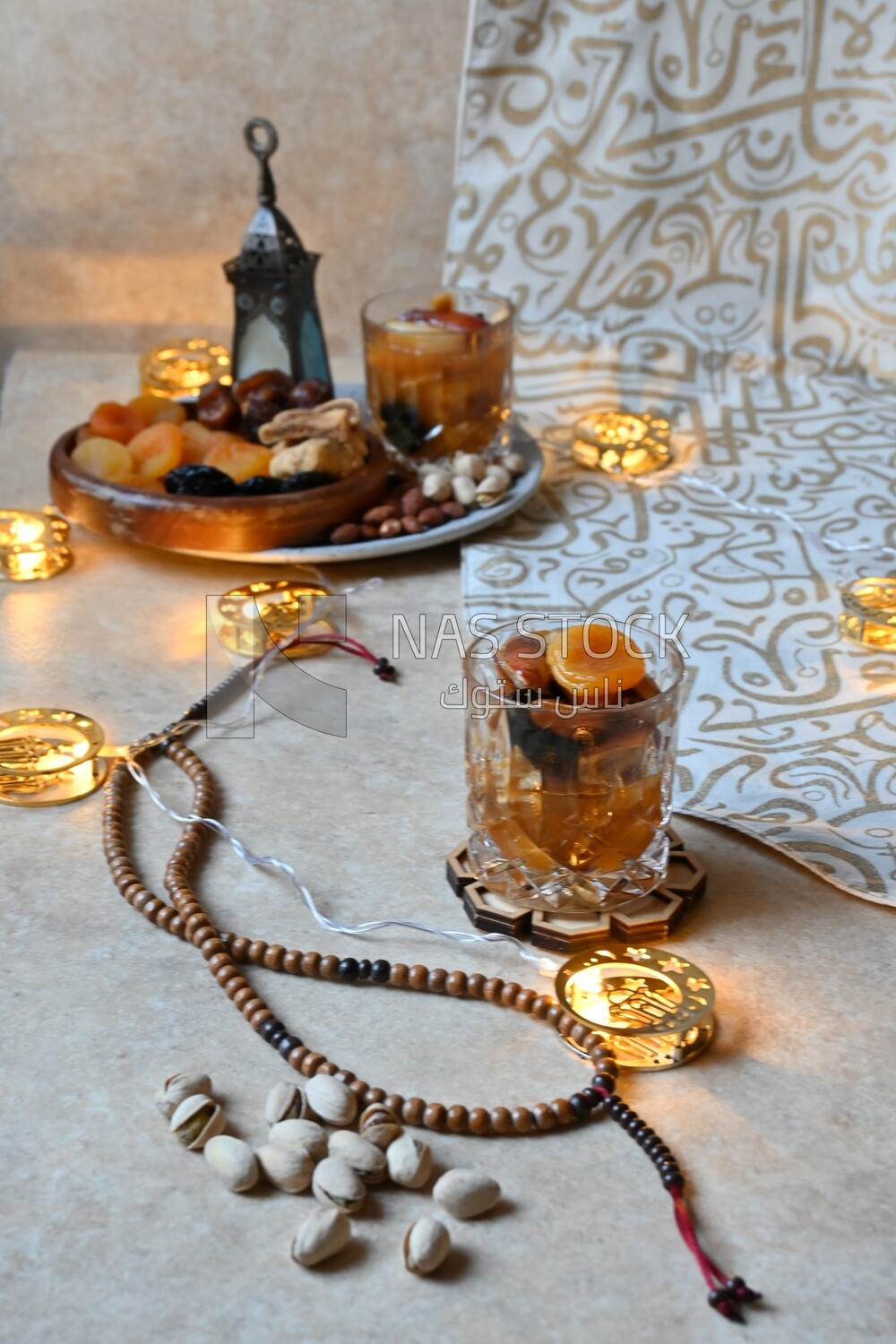 Two cups of khoshaf and a bowl full of khoshaf, Dried Fruit, and nuts salad, delicious dessert, Ramadan juice, delicious juice, traditional juice