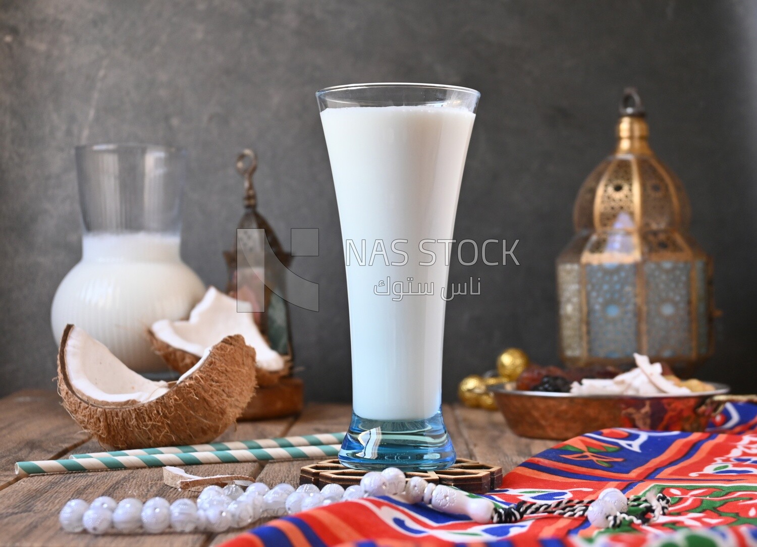 Cup of sobia beside a coconut, delicious dessert, Ramadan juice, delicious juice, traditional juice