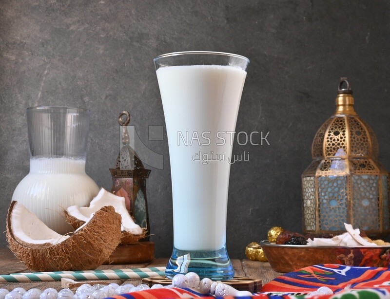 Cup of sobia beside a coconut, delicious dessert, Ramadan juice, delicious juice, traditional juice