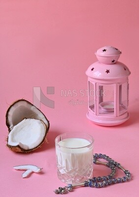 Cup of sobia beside a coconut, delicious dessert, Ramadan juice, delicious juice, traditional juice