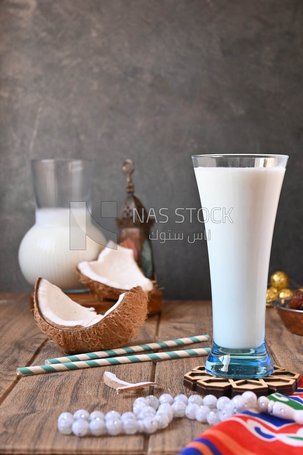 Cup of sobia beside a coconut, delicious dessert, Ramadan juice, delicious juice, traditional juice
