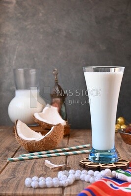 Cup of sobia beside a coconut, delicious dessert, Ramadan juice, delicious juice, traditional juice