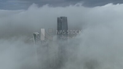 drone footage of clouds in Riyadh,  tourism in Saudi Arabia, King Abdullah Financial District (KAFD) Metro Station, Riyadh towers.