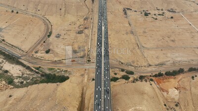 Drone footage of the suspension bridge in Riyadh, Saudi Arabia, Wadi Laban Bridge, architecture, traffic and cars, famous Riyadh landmarks.