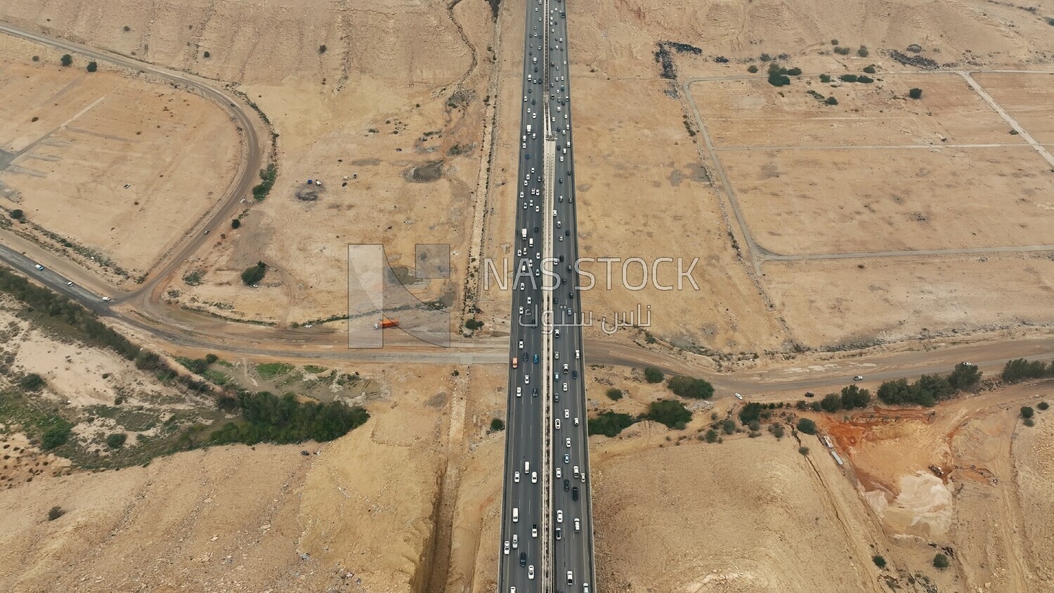 Drone footage of the suspension bridge in Riyadh, Saudi Arabia, Wadi Laban Bridge, architecture, traffic and cars, famous Riyadh landmarks.