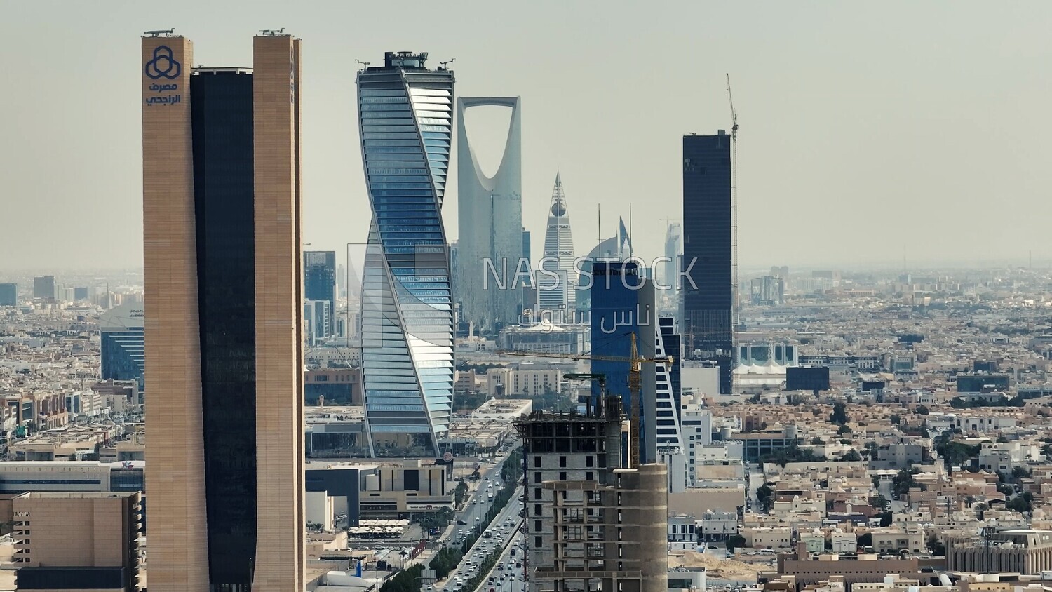 drone footage of King Fahd Road in Riyadh in the Kingdom of Saudi Arabia, Riyadh roads and streets, famous towers in Riyadh, city skyline in Riyadh.