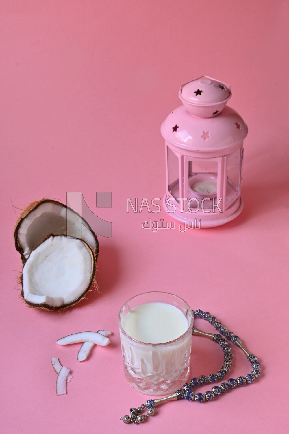 Cup of sobia beside a coconut, delicious dessert, Ramadan juice, delicious juice, traditional juice