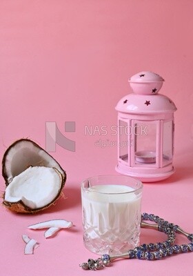 Cup of sobia beside a coconut, delicious dessert, Ramadan juice, delicious juice, traditional juice