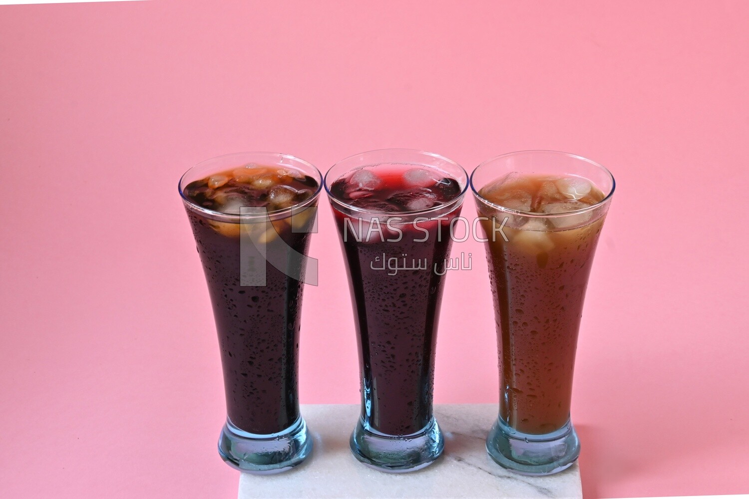Three cups of Arabian juice served in the holy month of Ramadan, carob, hibiscus, Ramadan drinks, Ramadan Juice