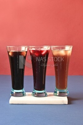 Three cups of Arabian juice served in the holy month of Ramadan, carob, hibiscus, Ramadan drinks, Ramadan Juices