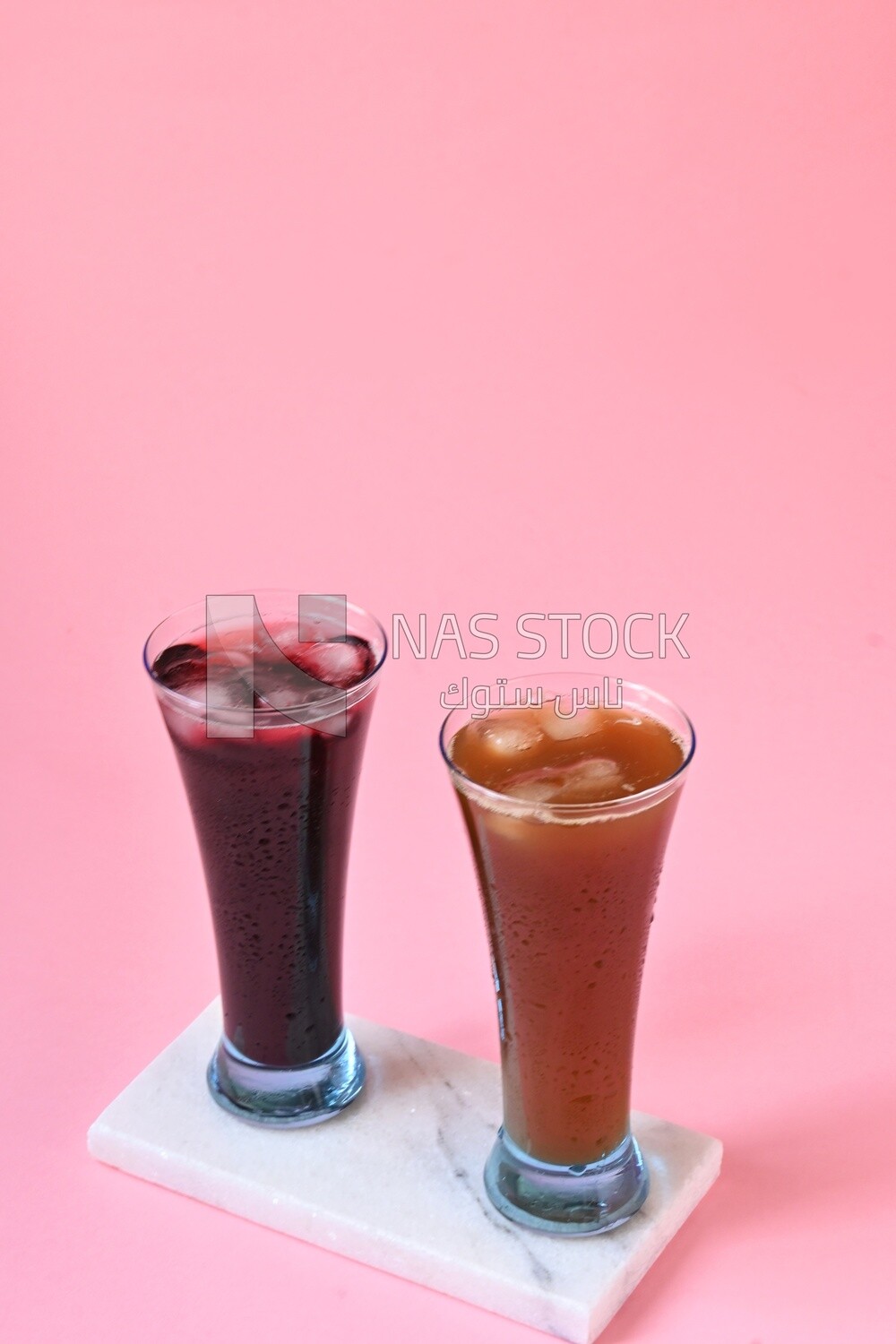 Two cups of Arabian juice served in the holy month of Ramadan, carob, hibiscus, Ramadan drinks, Ramadan Juices