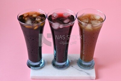 Three cups of Arabian juice served in the holy month of Ramadan, carob, hibiscus, Ramadan drinks, Ramadan Juices
