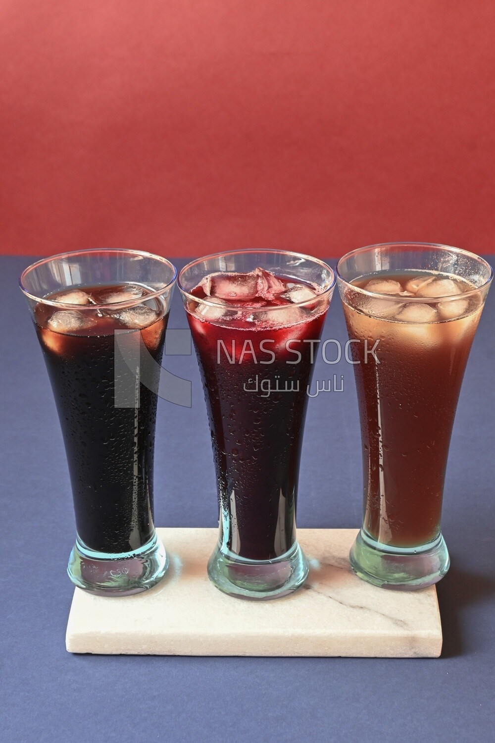 Three cups of Arabian juice served in the holy month of Ramadan, carob, hibiscus, Ramadan drinks, Ramadan Juices